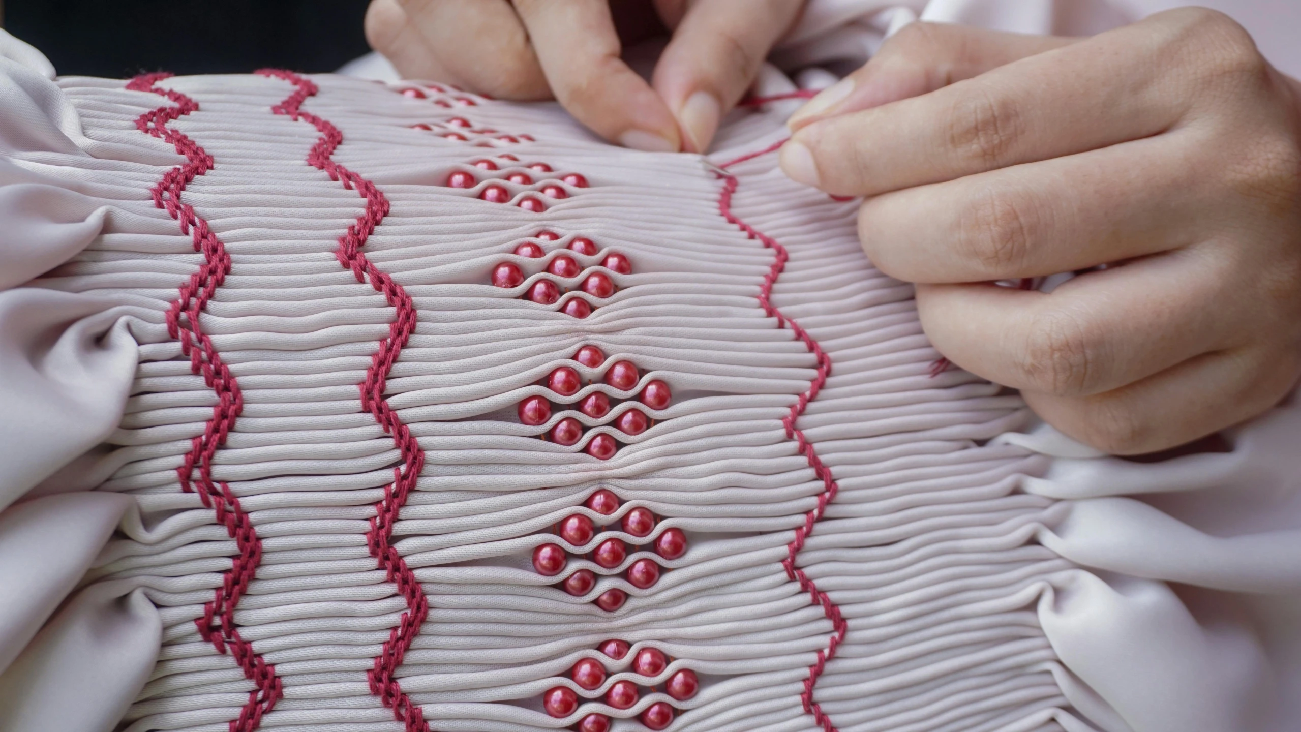 a woman who is stitching soing to someone