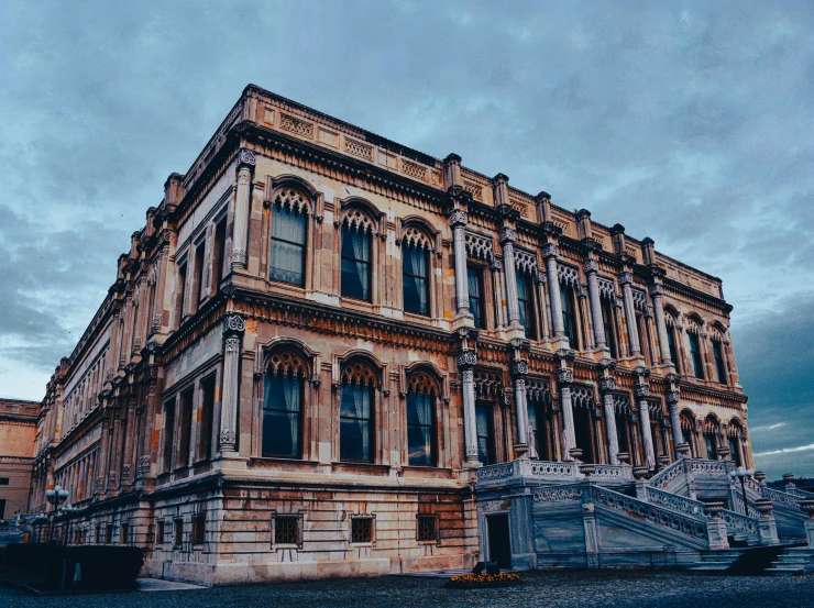 an old stone building with a large staircase