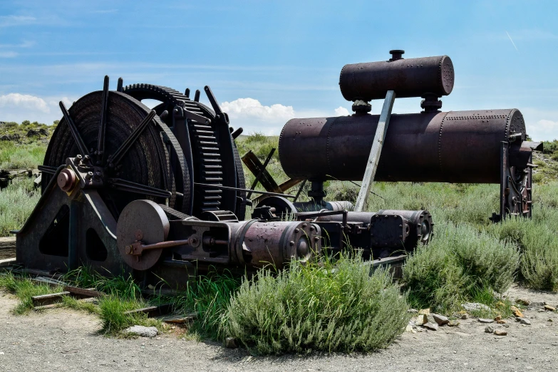 an old water supply sitting on the side of a road