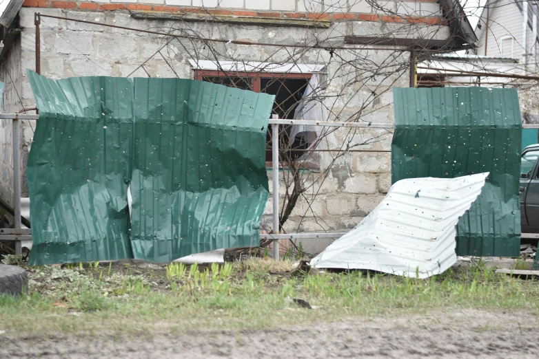 a building that is in the process of being demolished with an umbrella on it