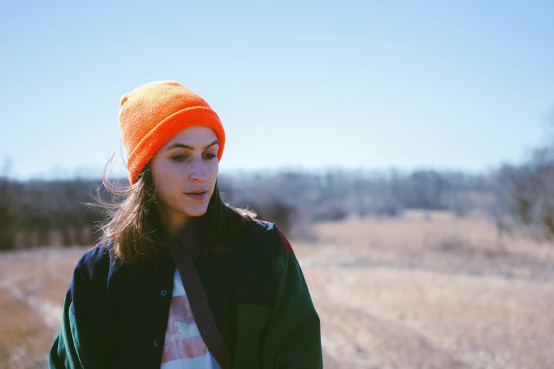 a girl with long hair in a field