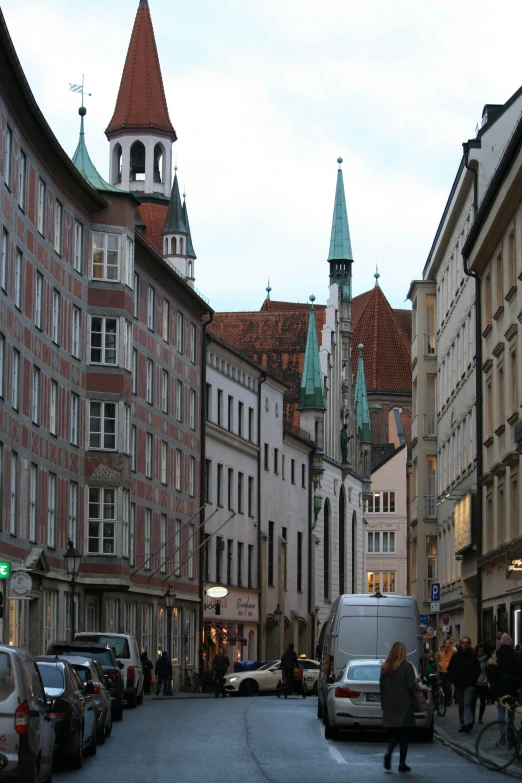 a woman is riding a bike on a city street