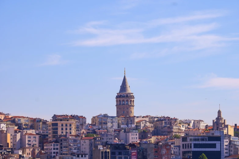 a large city with a clock tower towering over it's city skyline