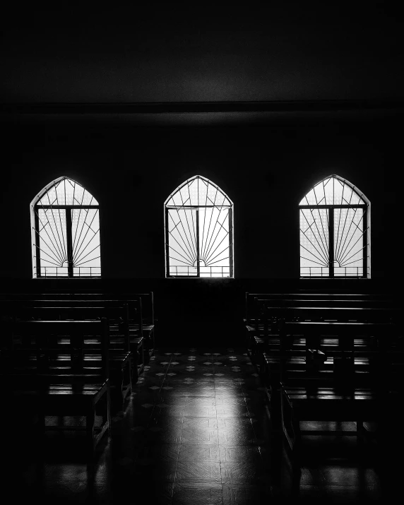 black and white po of a pews in a church