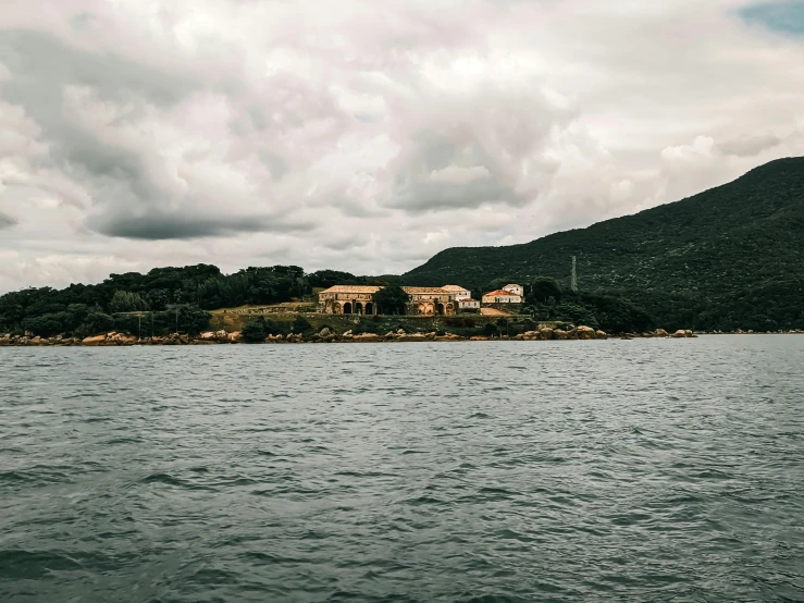 a small island with a house near by