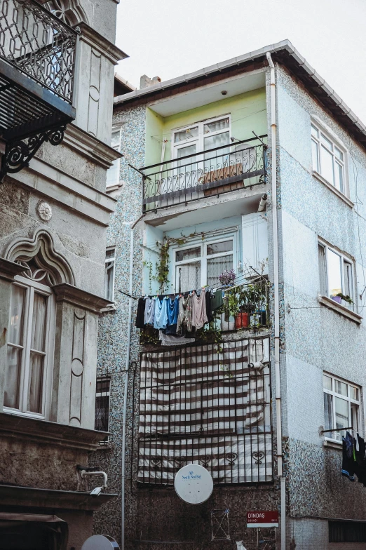 a house with an air plant and clothes hanging out