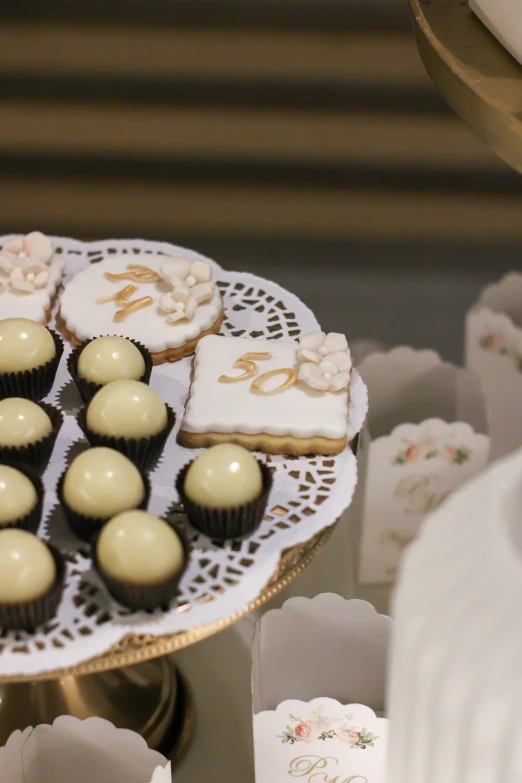 cup cakes and cookies on a small tray