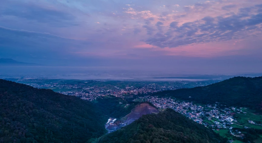 an aerial view of a town in a valley