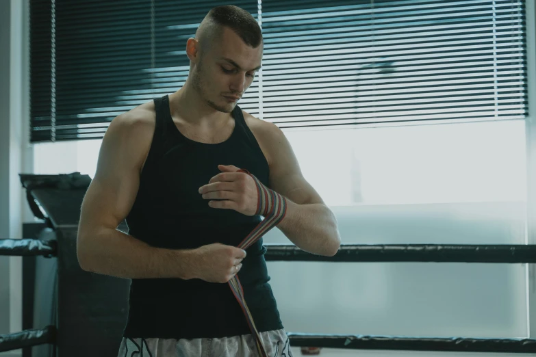 a young man is preparing to do soing at his gym