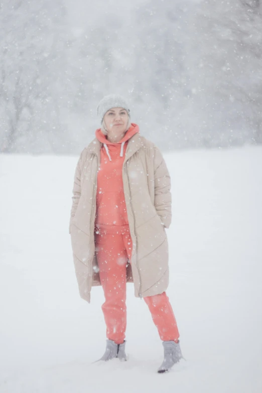 woman standing in the snow looking forward