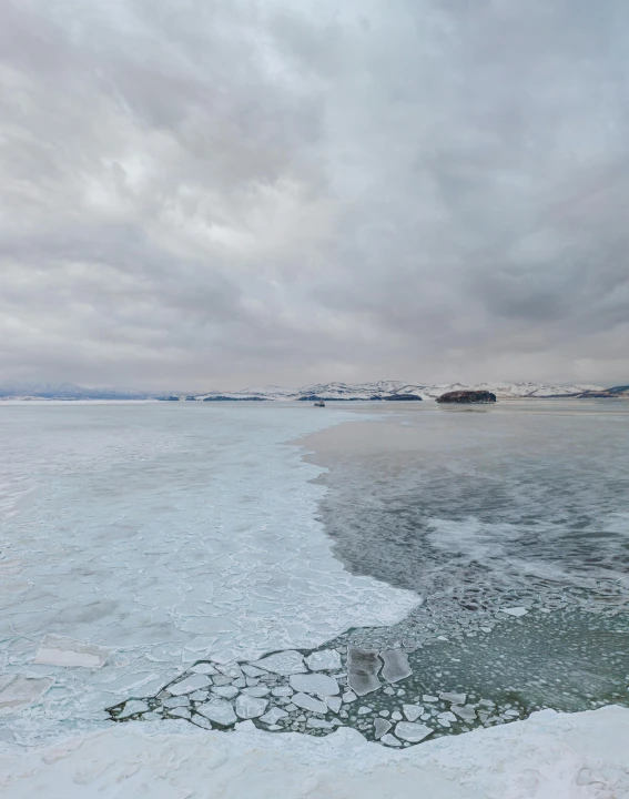 the large body of water has ice covered shoreline