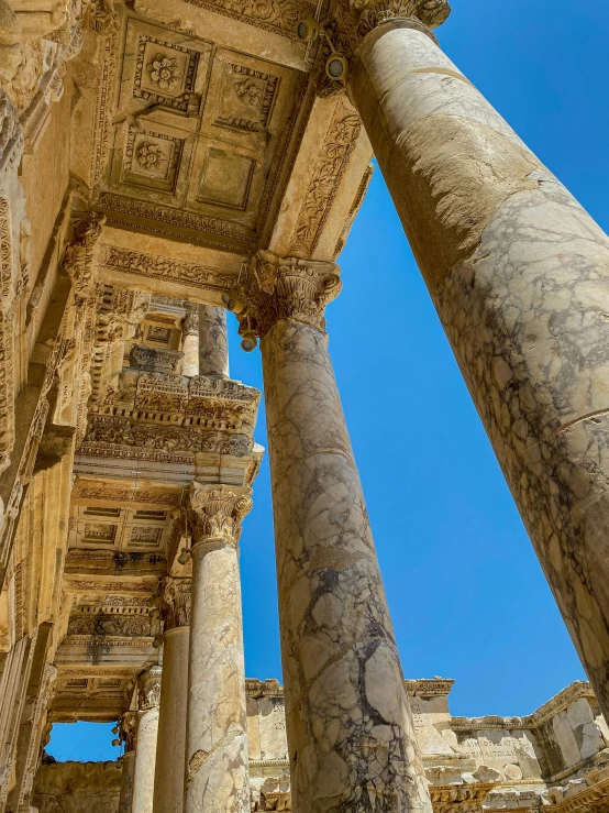 columns inside the ruins of a building, showing designs and colors