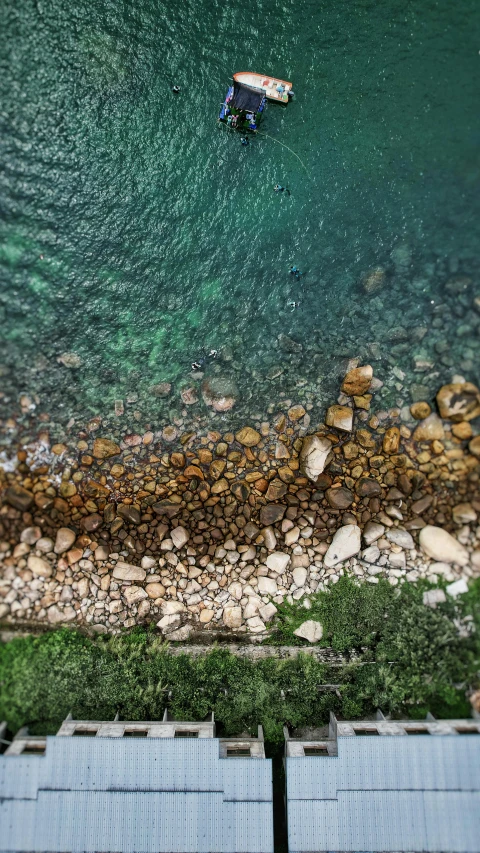 aerial view of two boaters in clear blue water