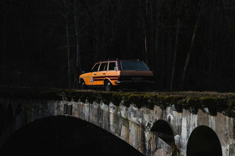 an old jeep parked on a bridge