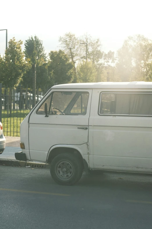 the small van is pulled over to the side of the street