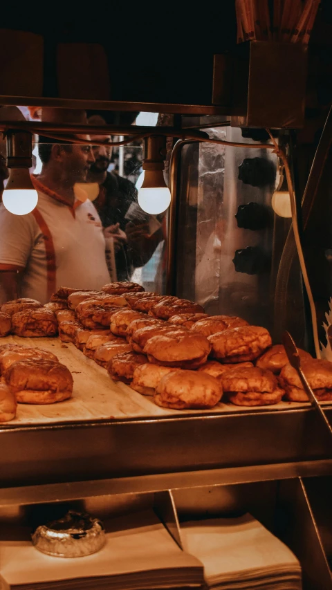 a bunch of doughnuts that are on a rack