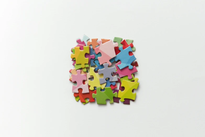 the colorful puzzles are stacked on top of each other