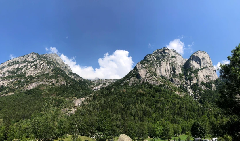 mountains rising above a river in the countryside