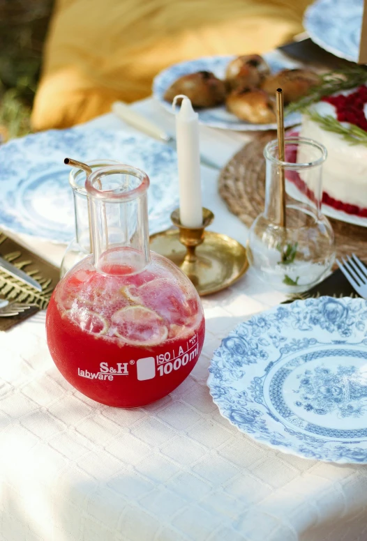 a table set up with many plates, food and some drinks