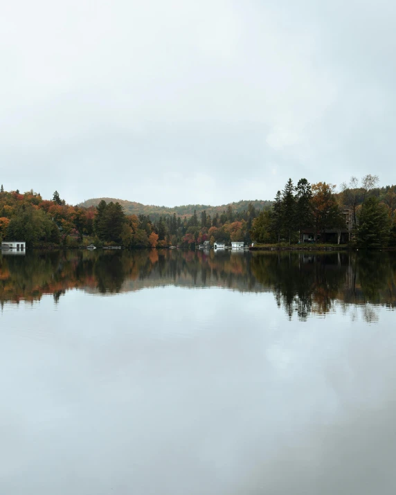 a small boat is on a calm lake