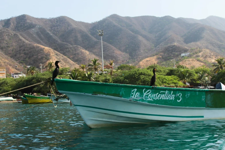 a couple of boats sitting in the water