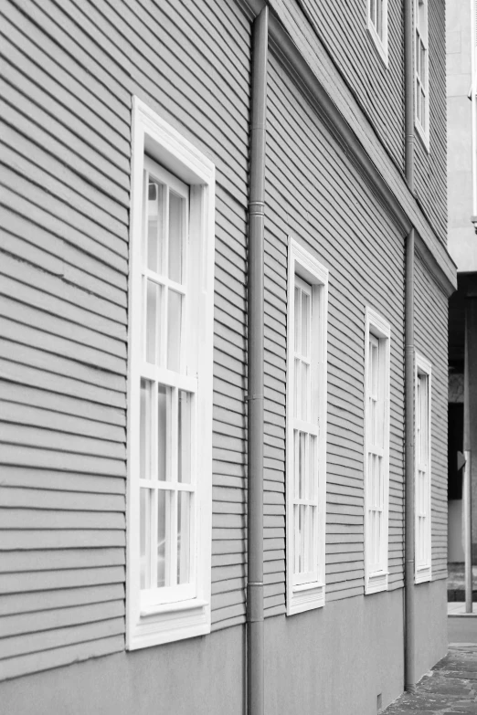 a row of old buildings with white windows