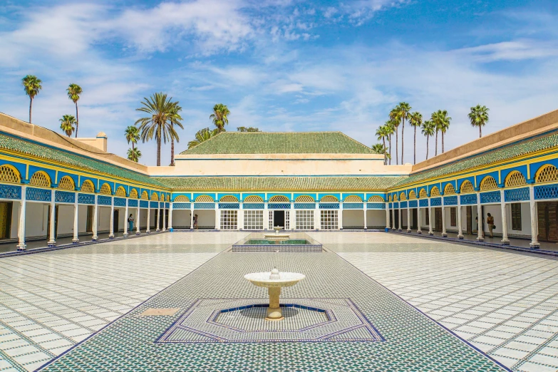 the courtyard in an old building with multiple blue and gold tile designs