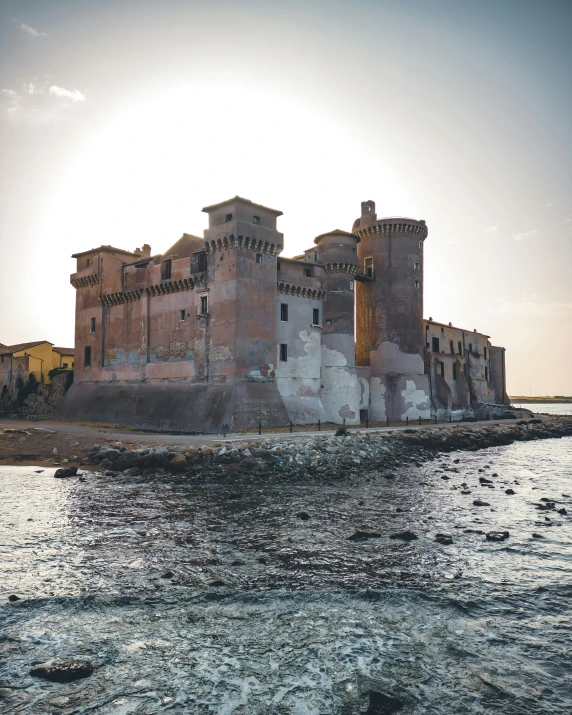 the old stone castle sitting on an island