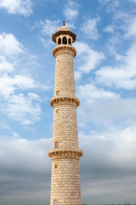 a tower made of bricks and bricks and blue sky