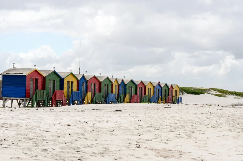 several buildings are lined up on the beach