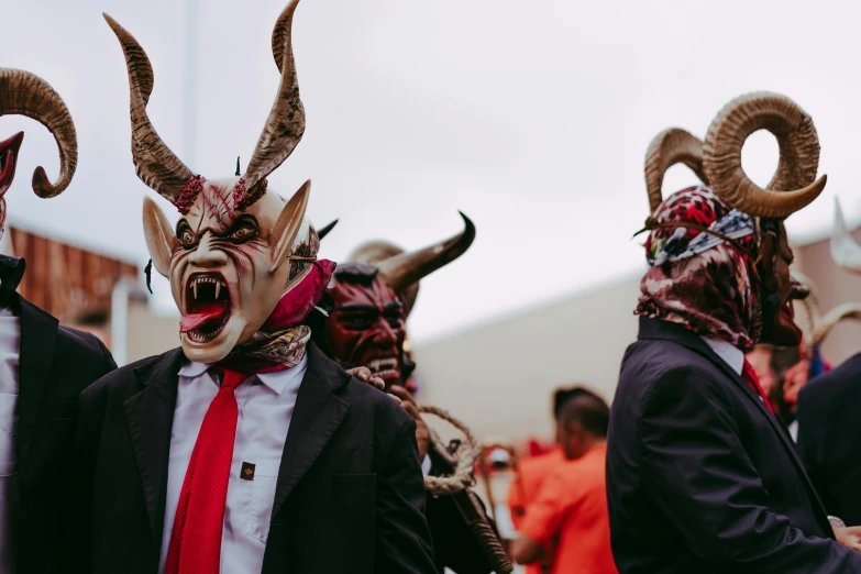 a group of people that are wearing masks