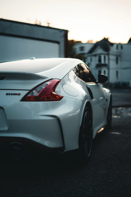 the back end of a sports car parked outside