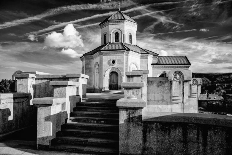 a very old church with steeples next to some steps