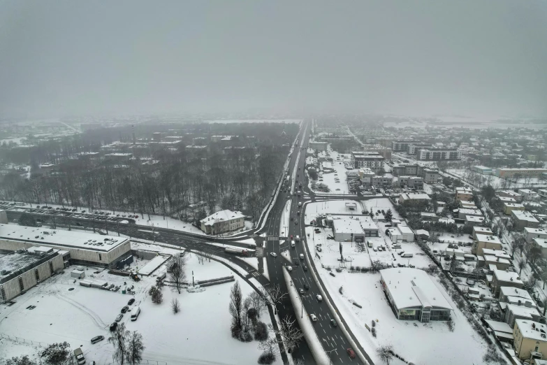 an aerial s of the snowy road in a city