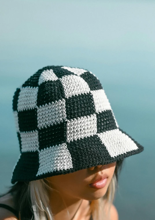 a close up of a woman wearing a hat