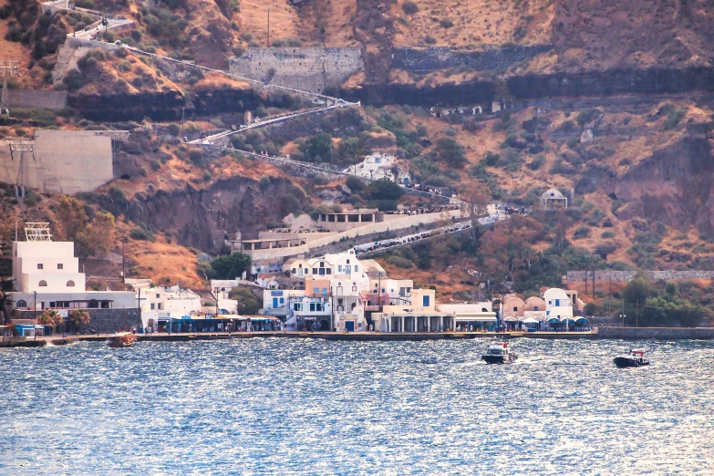 boats are in the water near a city