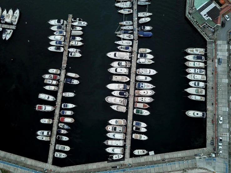 the boats are docked in the water next to the dock