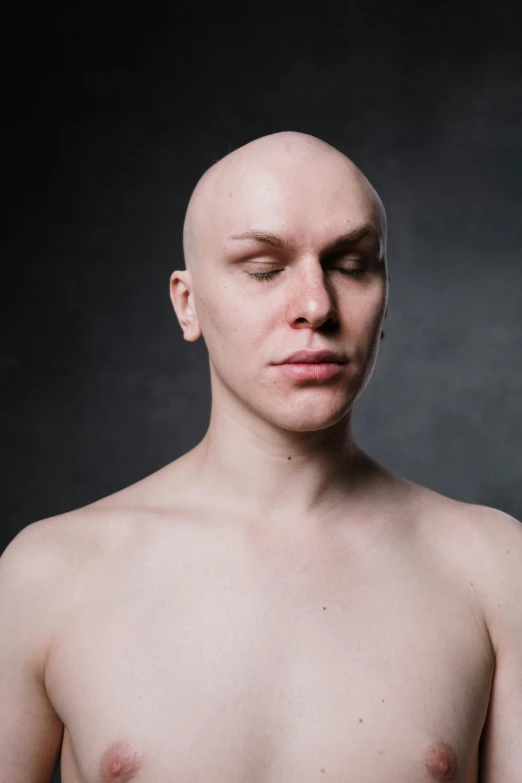 a man with  in front of a black background