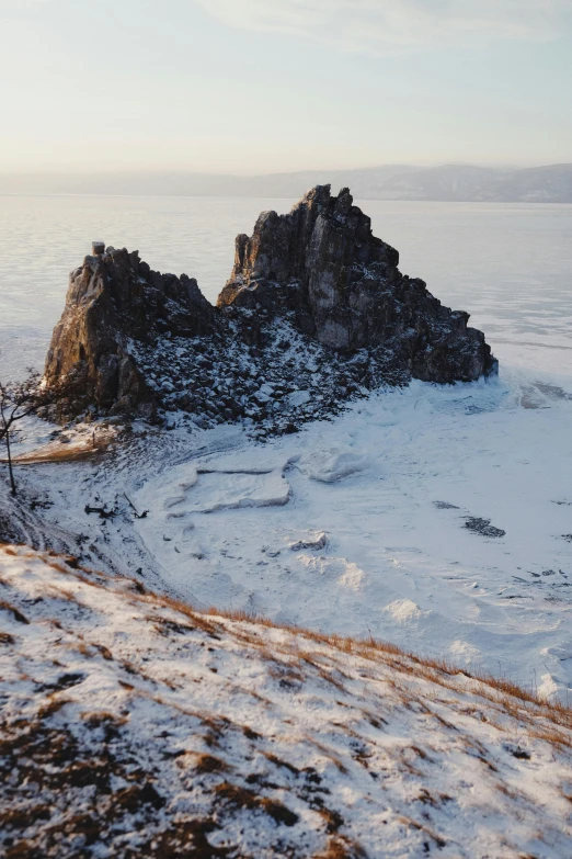 an aerial s of a snow covered rock formation