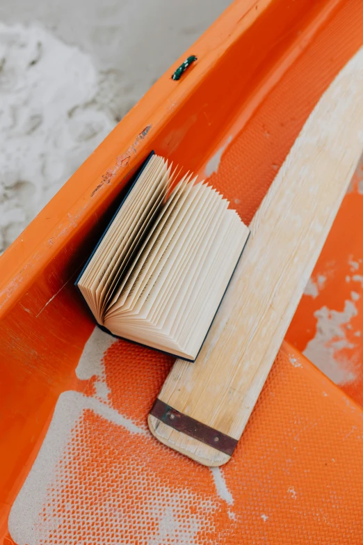 an open book lying on the edge of a boat