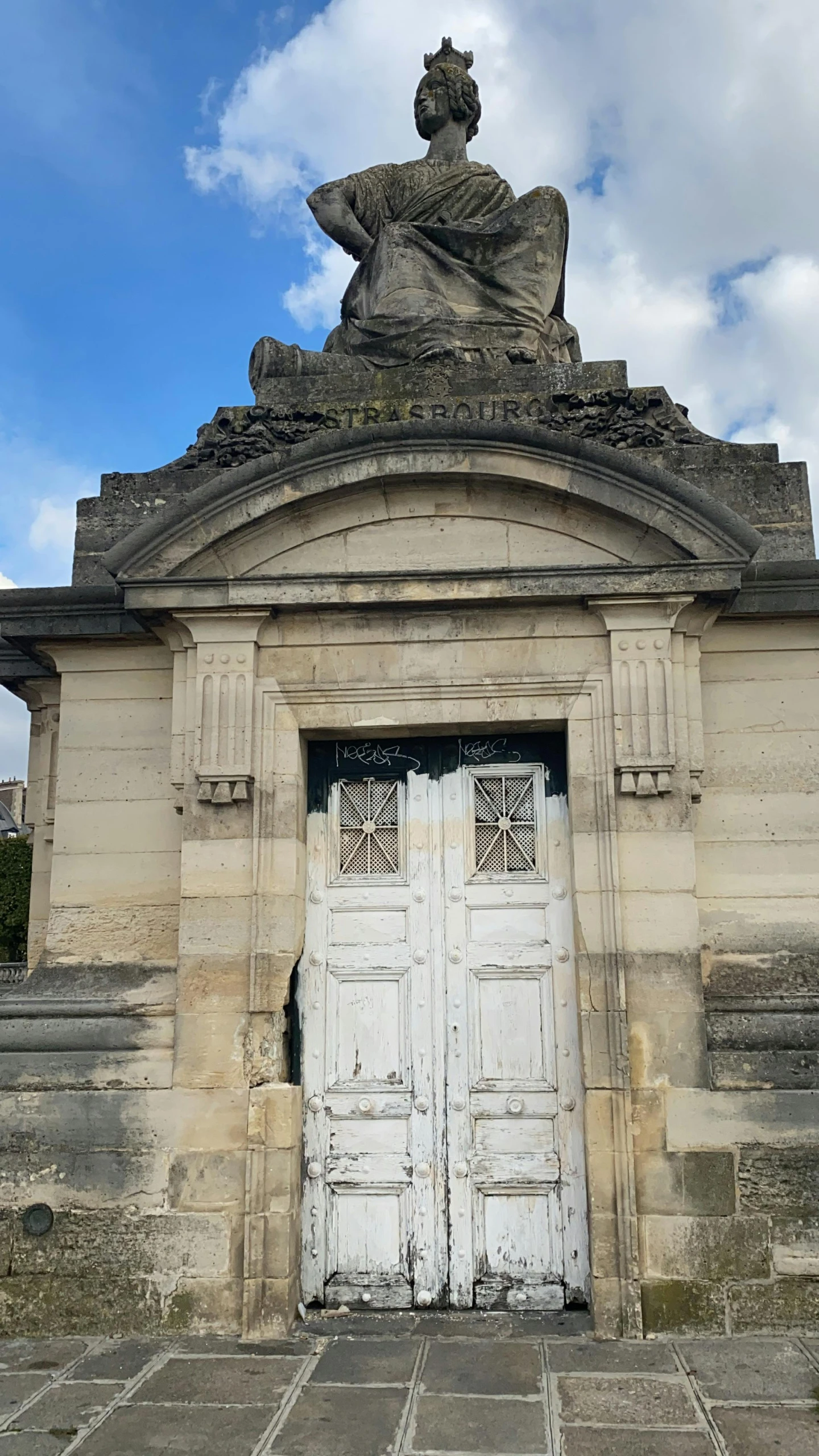 a large stone monument is near a doorway