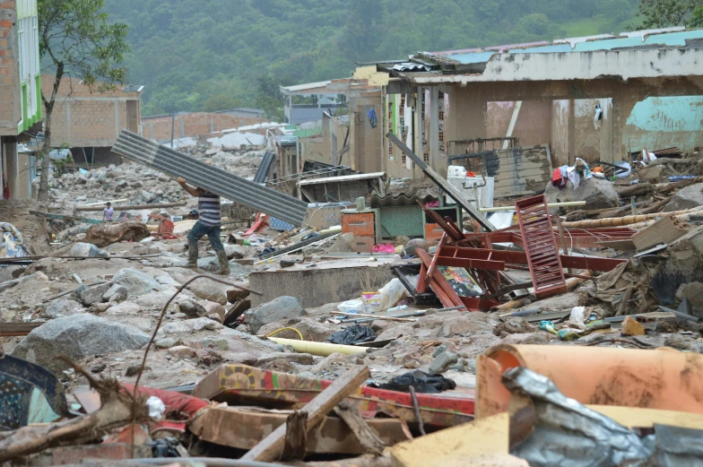 a bunch of rubble and other debris in a street