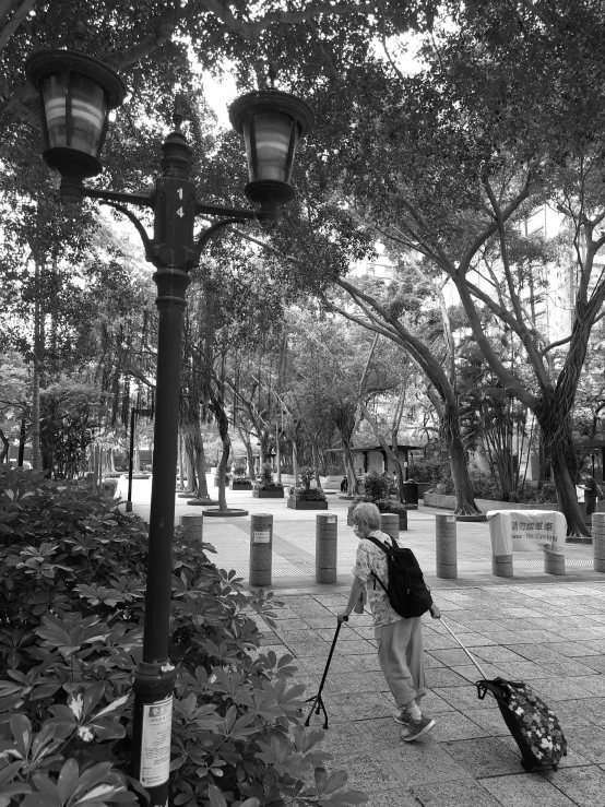 black and white po of a woman holding a camera