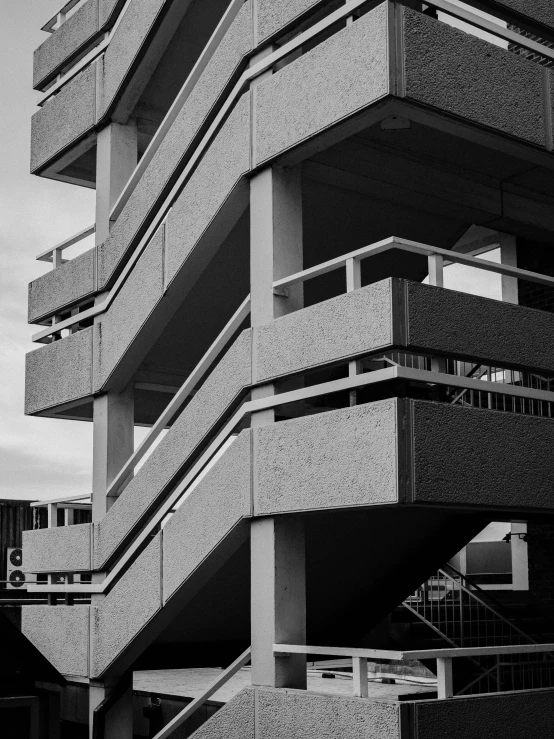 a black and white image of an apartment building