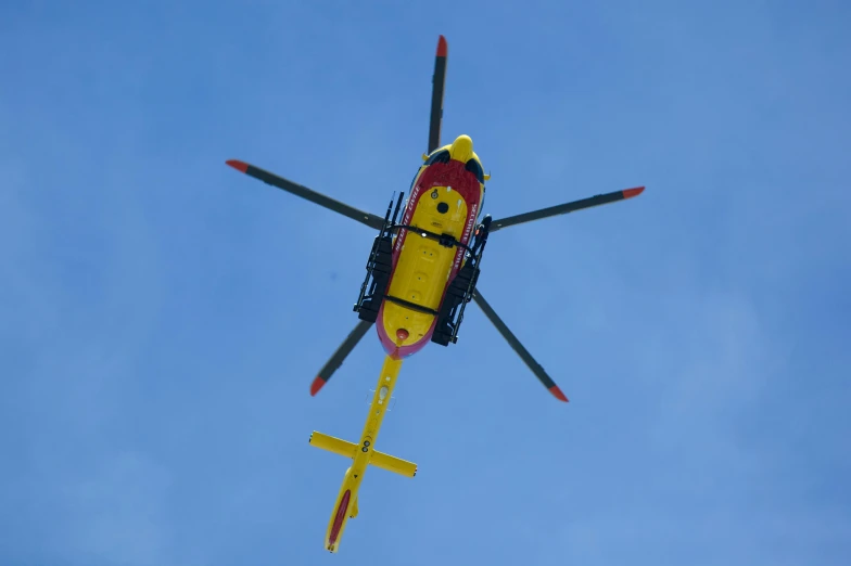 an airplane flying up in the sky above head