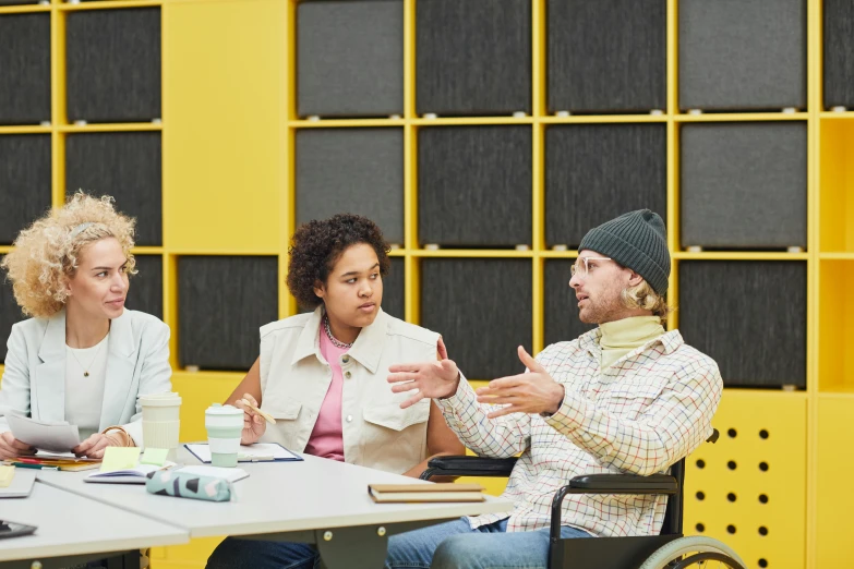 people sitting around a table and having a discussion