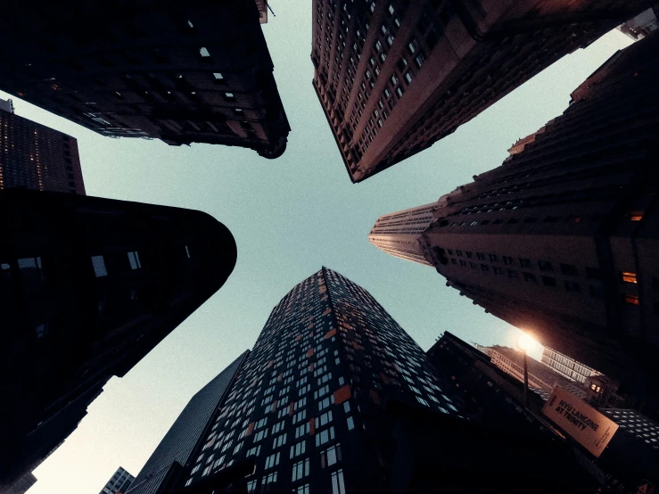 the view from below looking up at skyscrs