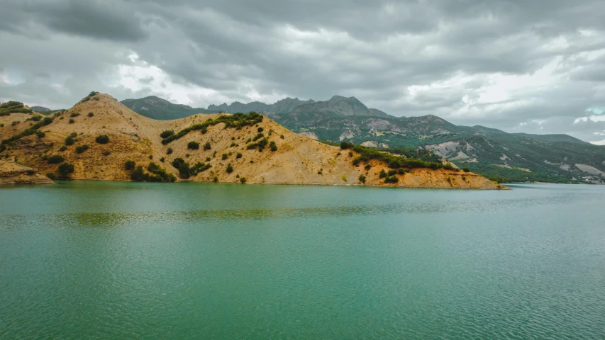 mountains and a lake on a stormy day