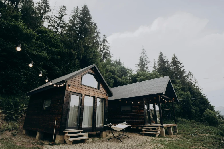 there is a small cabin with picnic table on the deck