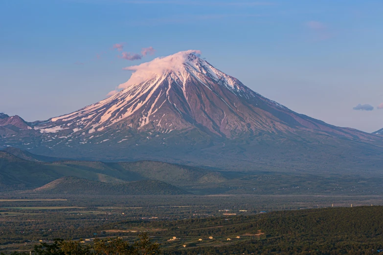 a view of the base of a mountain that is snow capped